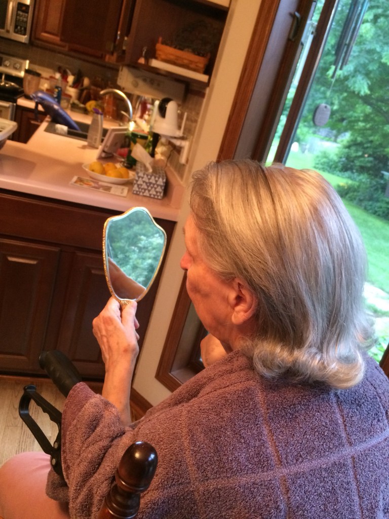 Momma inspecting her new hairdo.